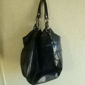 Good used leather Sak bag.